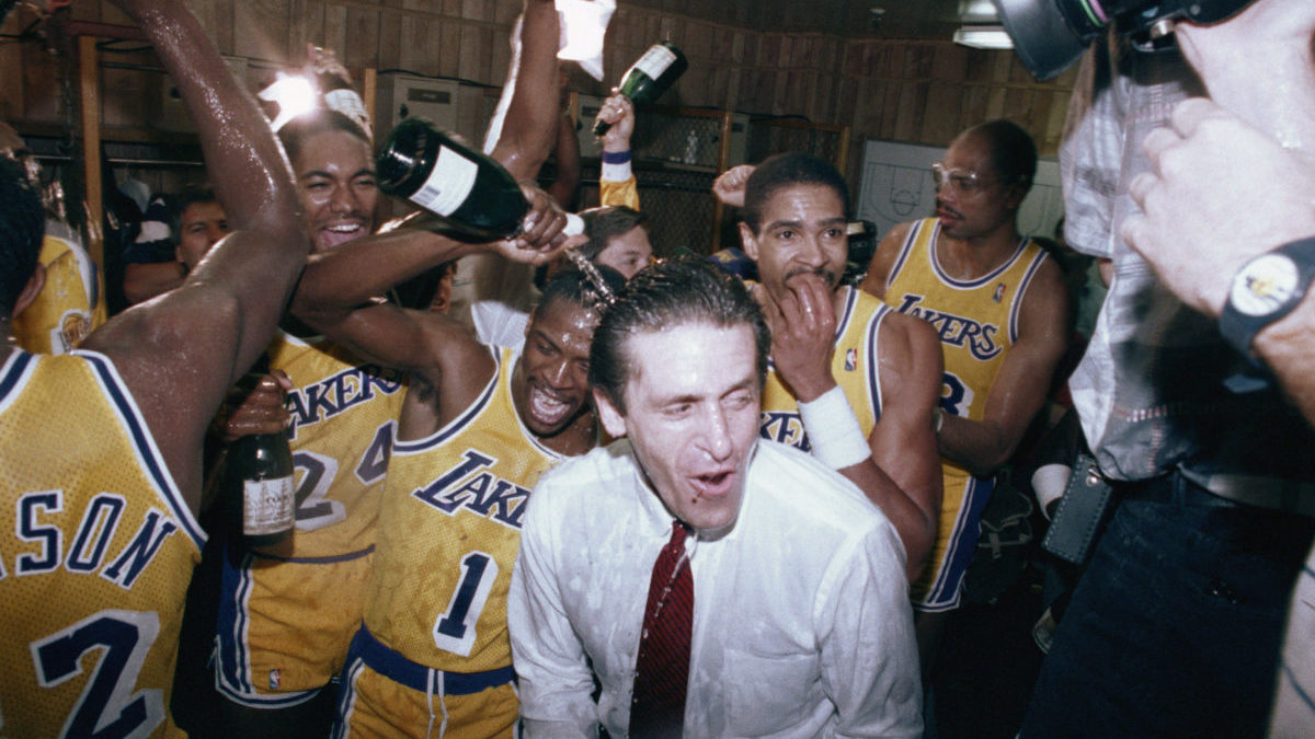 Pat Riley Getting A Champagne Bath From His Team The